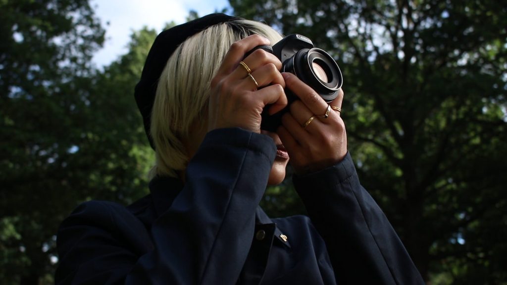 Canon 77D with the Canon EF-S 24mm f2.8 lens, held by a female model